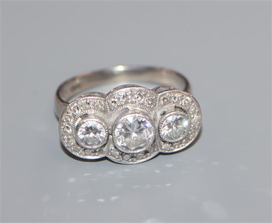 A 14k and diamond set triple cluster ring, with three central collet set round brilliant cut stones, size K.